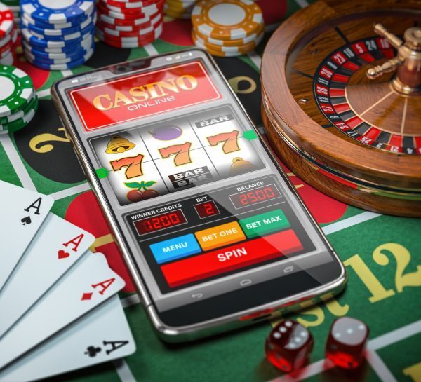 mobile laying on a casino table surrounded by casino games